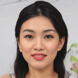 Joyful asian young-adult female with medium  black hair and brown eyes