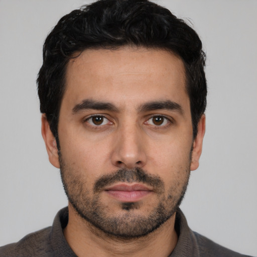 Neutral white young-adult male with short  black hair and brown eyes