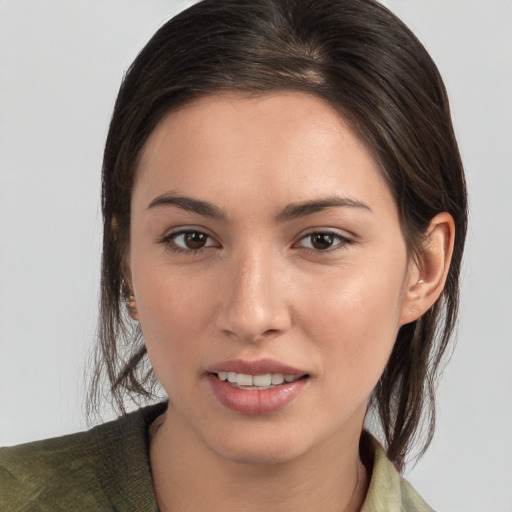 Joyful white young-adult female with medium  brown hair and brown eyes