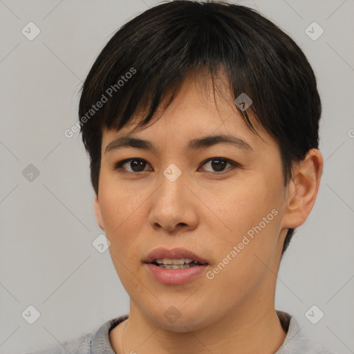 Joyful asian young-adult female with short  brown hair and brown eyes