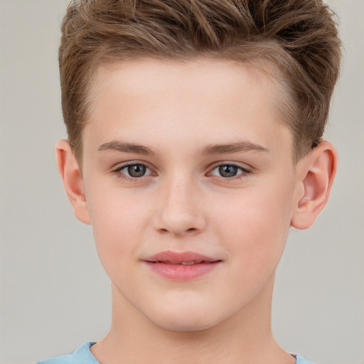 Joyful white child male with short  brown hair and brown eyes