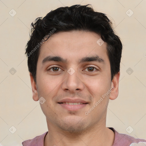 Joyful white young-adult male with short  black hair and brown eyes