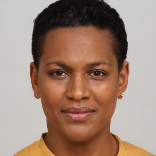 Joyful black young-adult female with short  brown hair and brown eyes