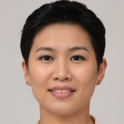 Joyful asian young-adult female with short  brown hair and brown eyes