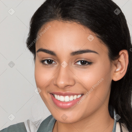 Joyful latino young-adult female with medium  brown hair and brown eyes