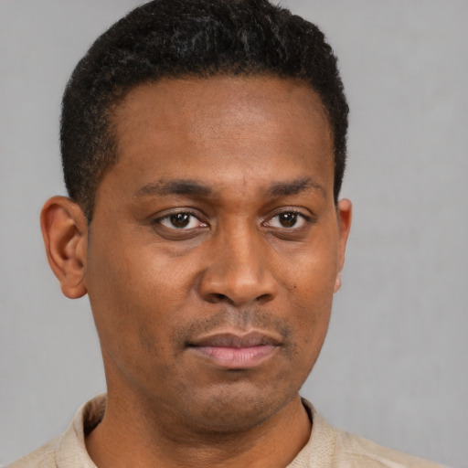 Neutral latino young-adult male with short  brown hair and brown eyes