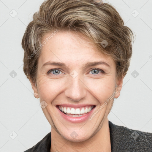 Joyful white young-adult female with short  brown hair and grey eyes