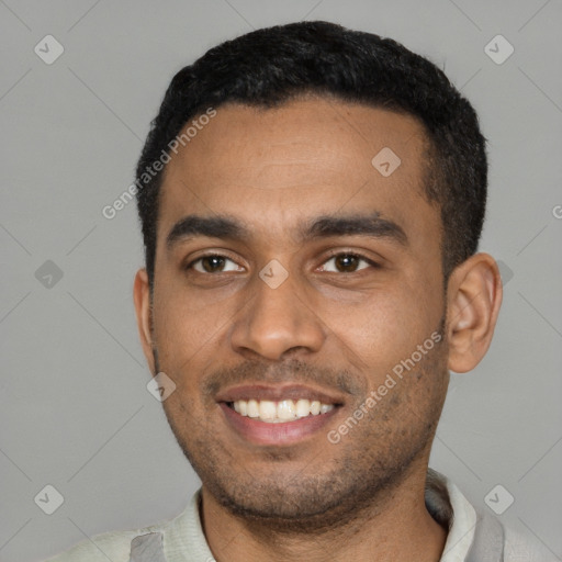 Joyful black young-adult male with short  black hair and brown eyes