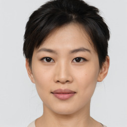 Joyful asian young-adult female with short  brown hair and brown eyes