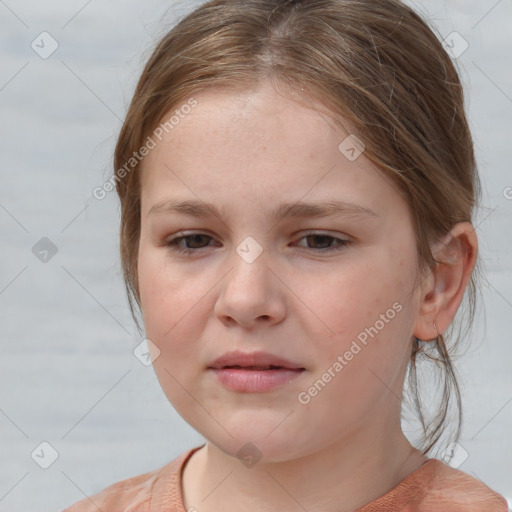 Joyful white child female with medium  brown hair and brown eyes