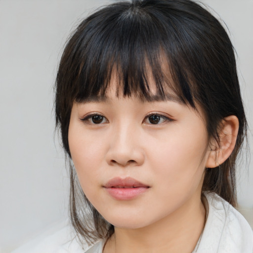 Neutral asian young-adult female with medium  brown hair and brown eyes