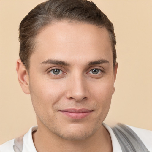 Joyful white young-adult male with short  brown hair and brown eyes