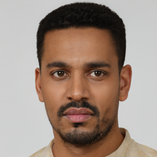 Neutral latino young-adult male with short  black hair and brown eyes