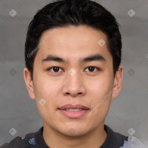 Joyful asian young-adult male with short  black hair and brown eyes