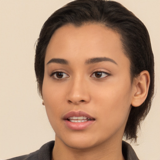 Joyful latino young-adult female with long  brown hair and brown eyes