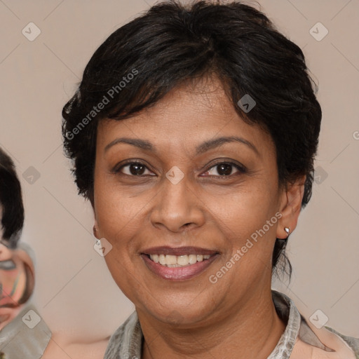 Joyful latino adult female with medium  brown hair and brown eyes