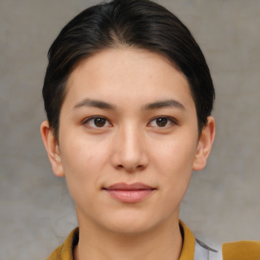 Joyful asian young-adult female with short  brown hair and brown eyes