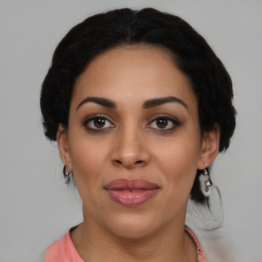Joyful latino young-adult female with medium  black hair and brown eyes