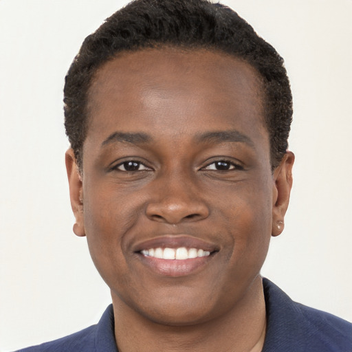 Joyful black young-adult male with short  brown hair and brown eyes