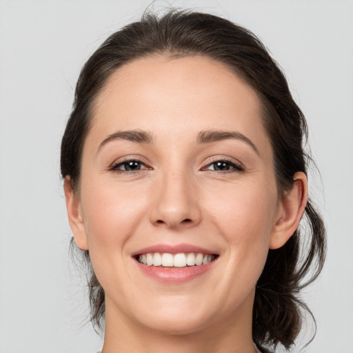 Joyful white young-adult female with medium  brown hair and brown eyes