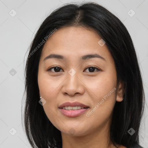 Joyful asian young-adult female with long  brown hair and brown eyes