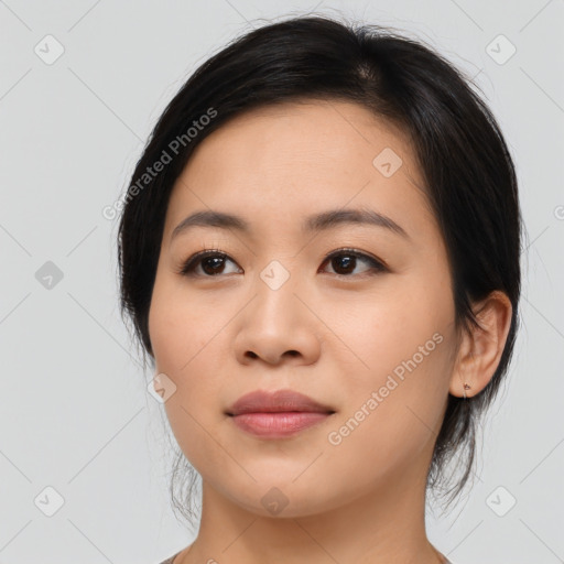 Joyful asian young-adult female with medium  black hair and brown eyes