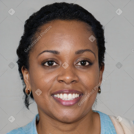 Joyful black young-adult female with short  black hair and brown eyes