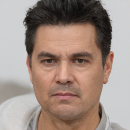 Neutral white adult male with short  black hair and brown eyes