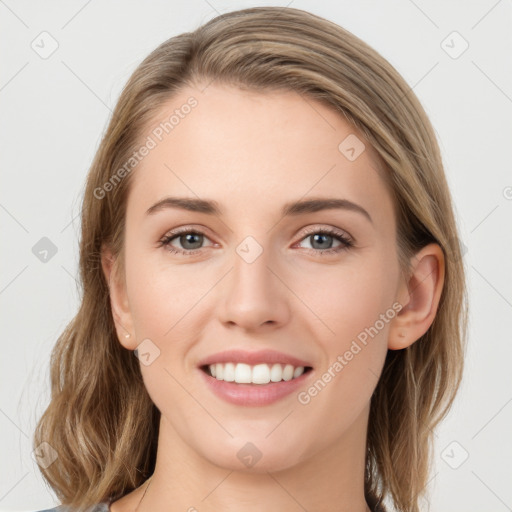 Joyful white young-adult female with long  brown hair and grey eyes