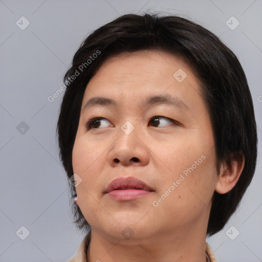 Neutral asian young-adult female with medium  brown hair and brown eyes
