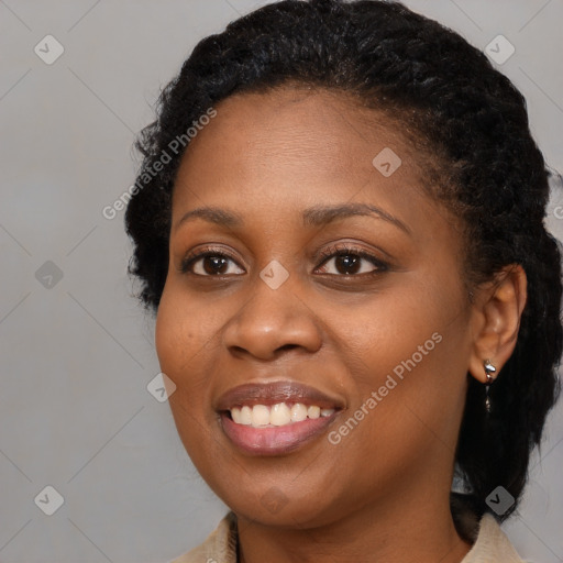 Joyful black young-adult female with medium  black hair and brown eyes