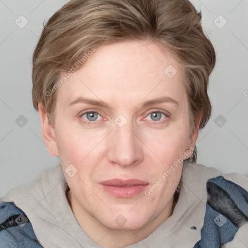 Joyful white adult female with medium  brown hair and blue eyes