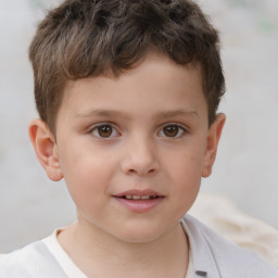 Joyful white child male with short  brown hair and brown eyes