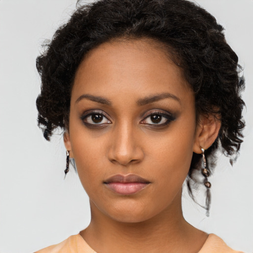 Neutral black young-adult female with long  black hair and brown eyes