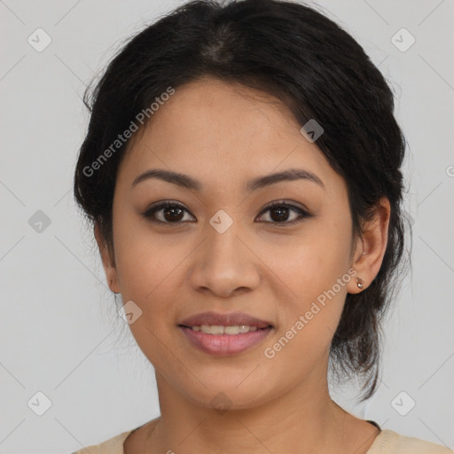 Joyful latino young-adult female with medium  brown hair and brown eyes