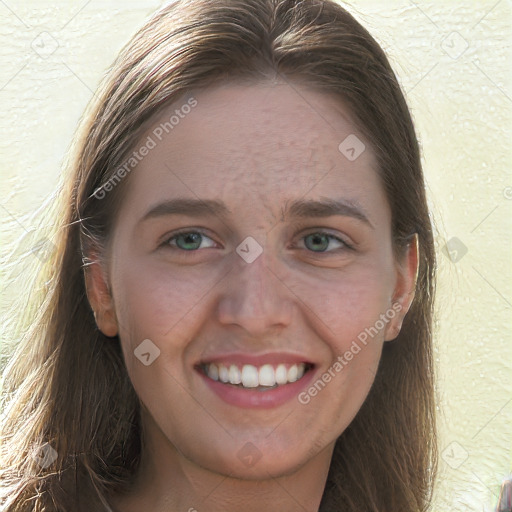 Joyful white young-adult female with long  brown hair and green eyes