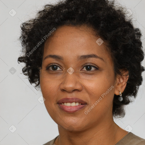 Joyful black adult female with short  brown hair and brown eyes