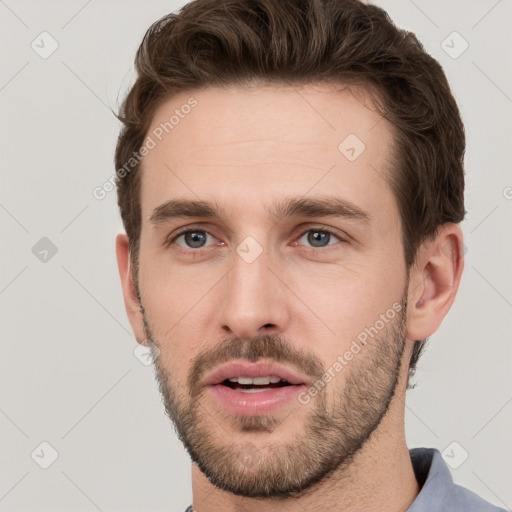 Neutral white young-adult male with short  brown hair and grey eyes