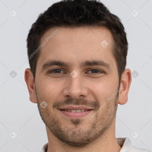 Joyful white young-adult male with short  brown hair and brown eyes