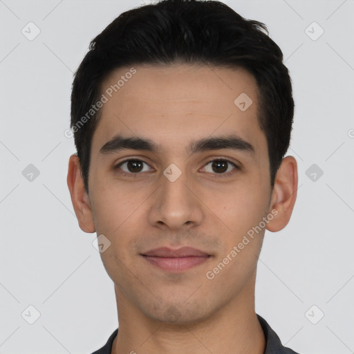 Joyful latino young-adult male with short  black hair and brown eyes