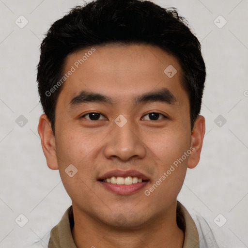 Joyful asian young-adult male with short  black hair and brown eyes