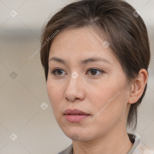 Neutral white young-adult female with medium  brown hair and brown eyes