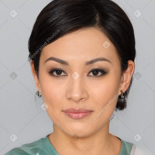 Joyful asian young-adult female with medium  black hair and brown eyes