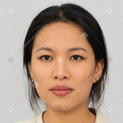 Joyful asian young-adult female with medium  black hair and brown eyes