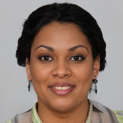 Joyful latino young-adult female with short  brown hair and brown eyes