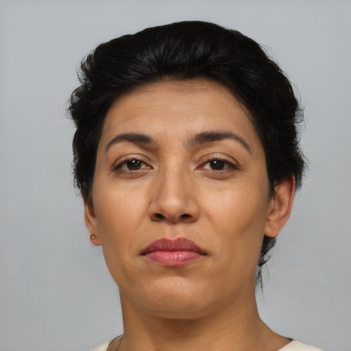 Neutral latino adult female with short  black hair and brown eyes