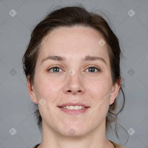 Joyful white adult female with medium  brown hair and grey eyes