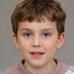 Joyful white child male with short  brown hair and brown eyes