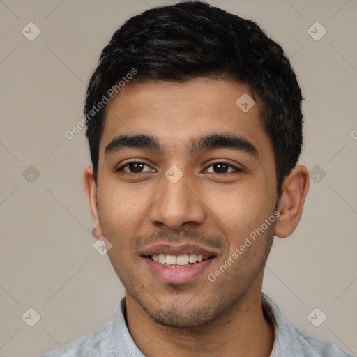 Joyful latino young-adult male with short  black hair and brown eyes