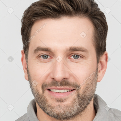 Joyful white adult male with short  brown hair and brown eyes